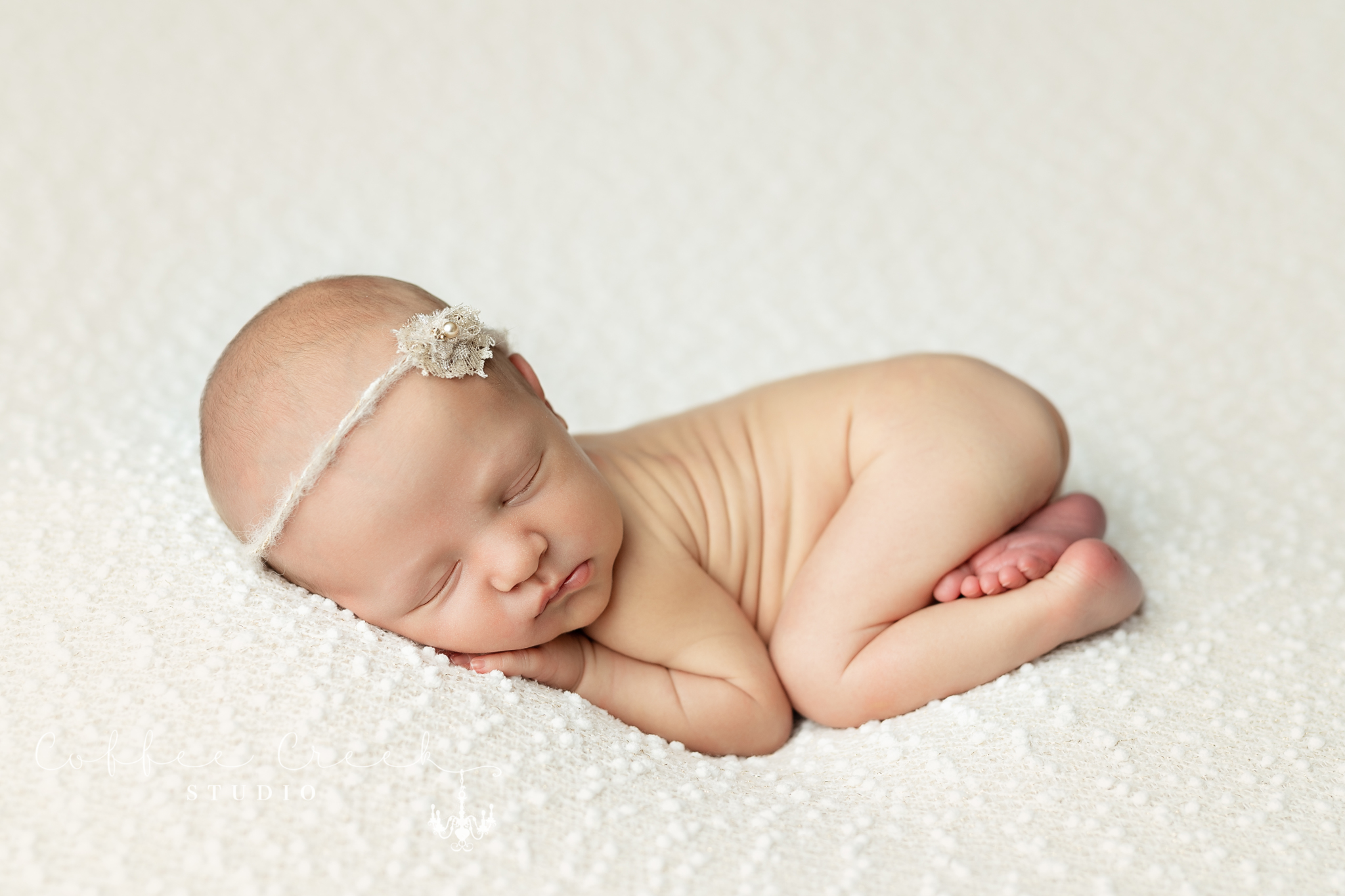 sleeping newborn baby girl posed