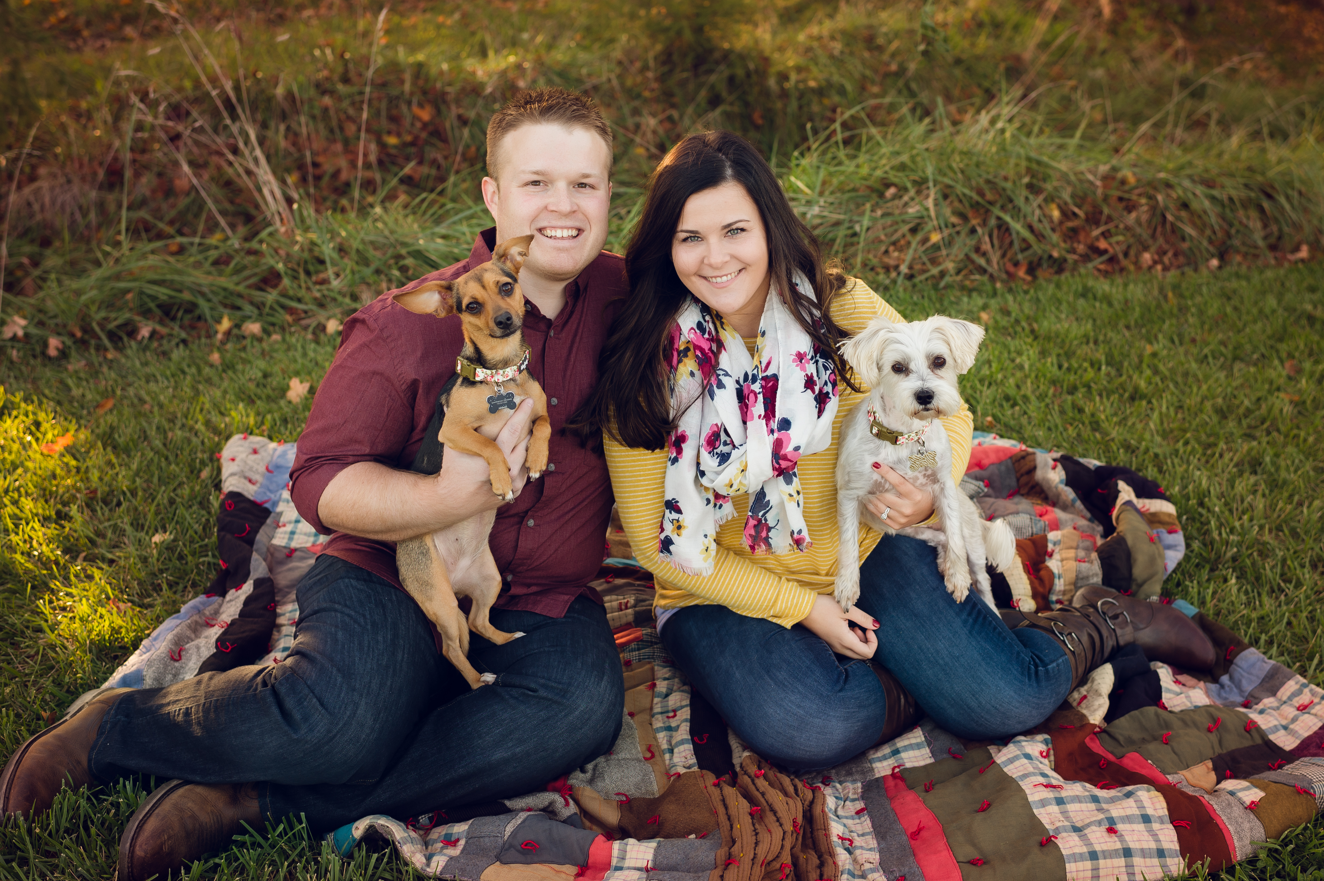 engaged couple and their dogs